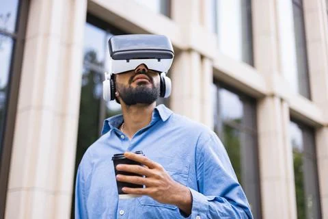 Man in VR Headset with Coffee Stock Photos