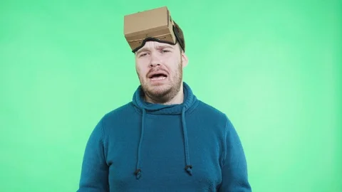 Man in vr headset enjoy on the green background Stock Footage 87381438