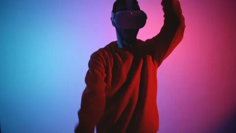 Man with VR headset fighting enemies in Virtual reality  Stock Footage 143639239