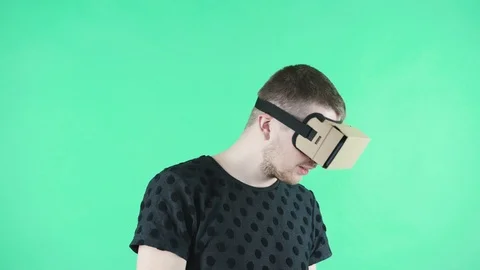 Man in vr headset on the green background Stock Footage 87729117