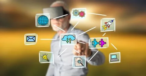 Man with VR headset touching a cloud computing concept on a touch screen 스톡 사진