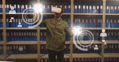 Man in VR headset touching interface with flares Foto stock