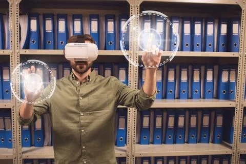Man in VR headset touching interfaces with flares Foto stock