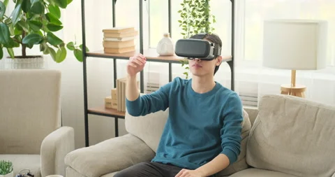 Man in VR headset virtually moving objects Stock Footage 145295148