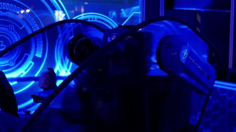 Man in VR-mask playing 5D cyber game in simulating machine Video stock 67251523