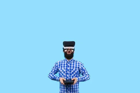 Man in VR with remote control Stock Photos