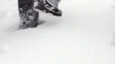 Man wades knee-deep through snow Stock Footage 1090239