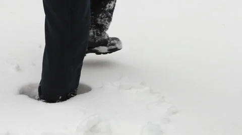 Man wades knee-deep through snow Stock Footage 1880586