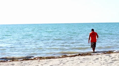 Man wading on a beach in the FL Keys Stock Footage 32789500