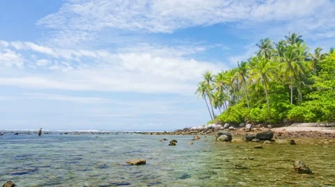 Man Wading in Shallows along Wild Tropical Beach in Thailand Stock Footage 48338086