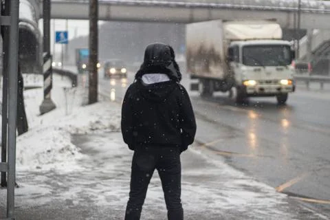 A man is waiting for a bus. Stock Photos