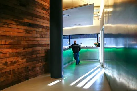Man waiting at design reception Stock Photos