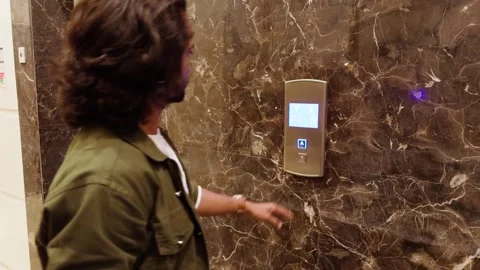 Man waiting in front of elevator Stock Footage 276776001