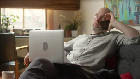 Man waiting on hold finally gets through to support to talk about a bill Stock-Footage 133290059