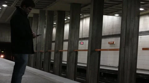 Man waiting on marta train Stock Footage 45182147