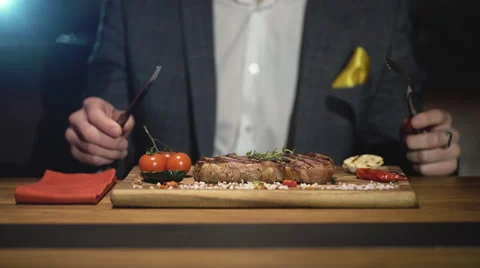 Man is waiting order in a steak bar or restaurant Stock Footage 62079855