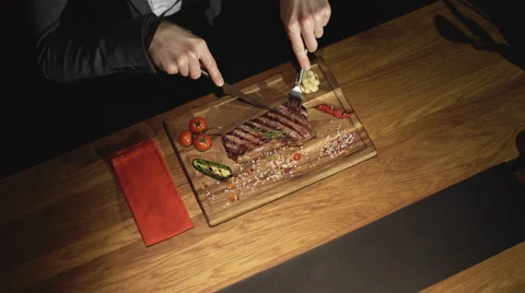Man is waiting order in a steak bar or restaurant Stock Footage 62080009