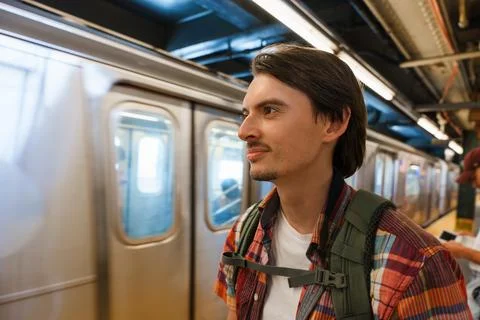 Man Waiting On Subway Platform With Backpack Stock Photos