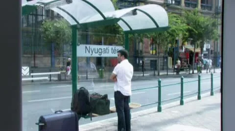 Man waiting for tram at tram stop in Budapest Stockbeeldmateriaal 10899354