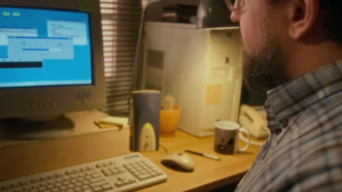 Man Waiting for Vintage Computer to Connect to Internet with Dialup Modem Video stock 327232845