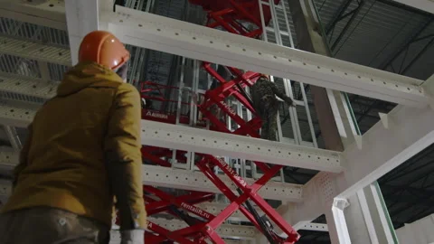Man waits for freight-passenger elevator going down in shop Stock Footage 258762523
