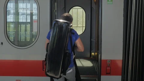 A Man waits for the Train Door to open before Boarding Stock Footage 92770917