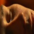 The man wake up in the morning. Close up face. Real time capture 4k or 4k+ Resolution