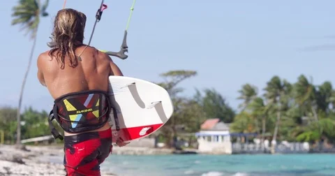 Man With Wakeboard On Beach Stock Footage 79738331
