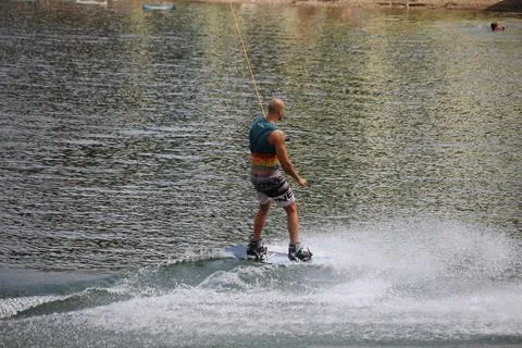 A man on a wakeboard Stock Photos