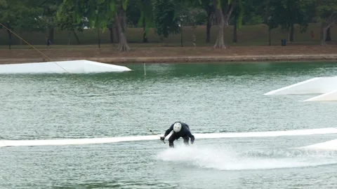 Man Wakeboarding at a Cable Ski Park in Singapore Stock-Footage 328488313