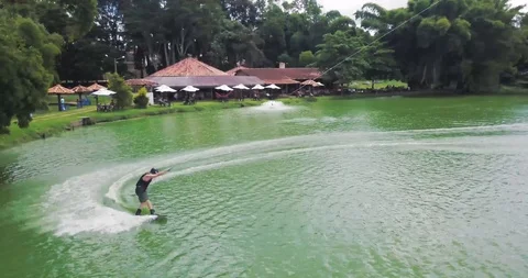 Man Wakeboarding Cable at Wakeboard Park. Water Extreme Sport Vídeo Stock 88976721
