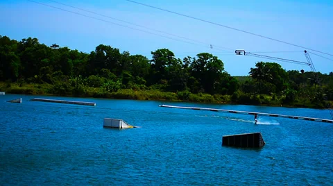 Man on wakeboarding jumps on the trampoline Video stock 36404319
