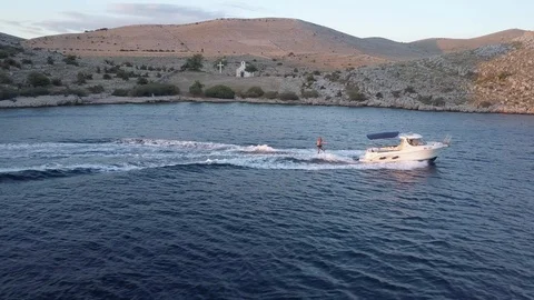 Man wakeboarding in the ocean at sunset Video stock 85823251
