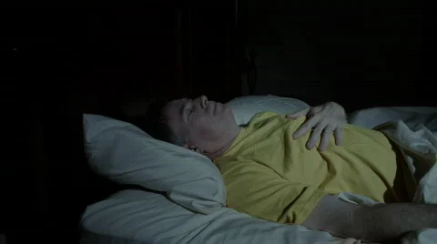 Man wakes indigestion Stock Footage