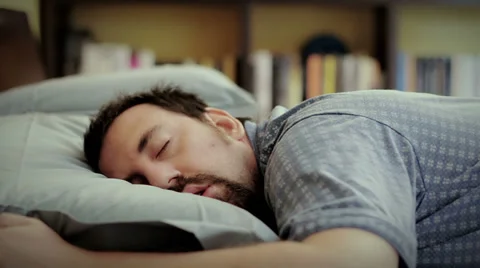 A man wakes up in the morning Stock Footage 28227342