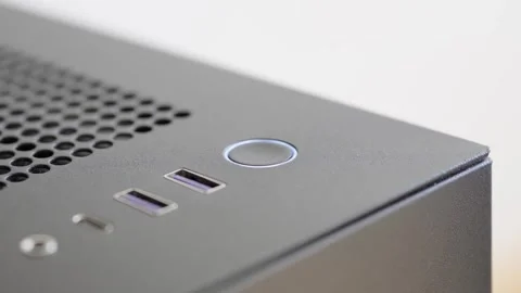 Man waking up a computer from sleep mode by pressing the power button. Close up Stock Footage 305153408