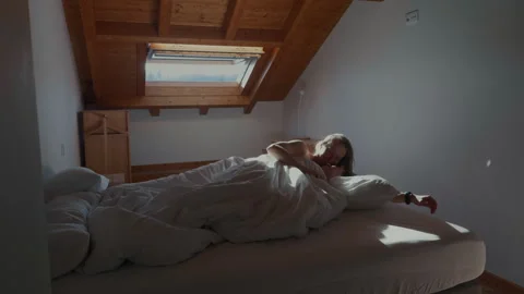 Man waking up girlfriend in bed gentle romantic morning scene Stock Footage 332558573