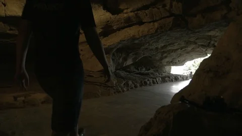 A man waking inside The Old Original Bai Dinh Temple cave on the moutain, par Stock Footage 128222021