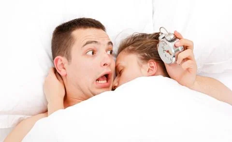 Man waking up lately Stock-Fotos