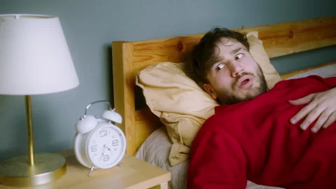 Man Waking Up in Shock After a Nightmare  Sleep Paralysis or Sleep Apnea Re.. Stock Footage 303915982