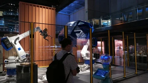 Man walk after moving robot at science museum, Barcelona Stock Footage 100269620