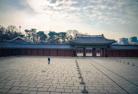 A man walk alone in a square Stock Photos