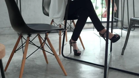 Man walk in and sit down on chair with female Video stock 101865380