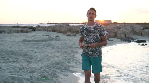 Man walk on the background of beautiful beach with white sand and beautiful Stock Footage 85200297