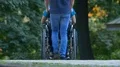 The man walk with a disabled on the street. Real time 4k or 4k+ Resolution