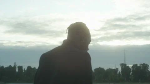 A man walk on a field with trees in the background Video stock 231112428