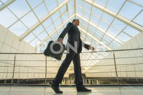 The man walk in the office balcony Stock Photos