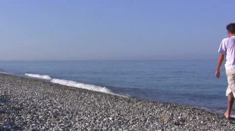 The man walk on a seaside Stock Footage 26351186