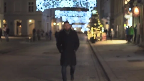 Man walk up, smiling at camera at night, Christmas time, steadycam 库存影片 72782098