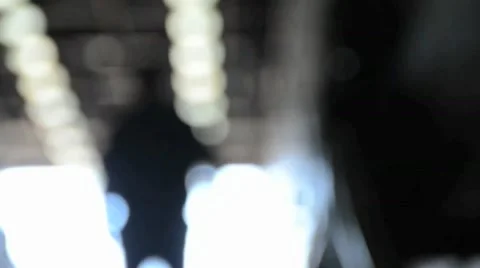 Man walking abstract lights out of focus Stock Footage 10759761